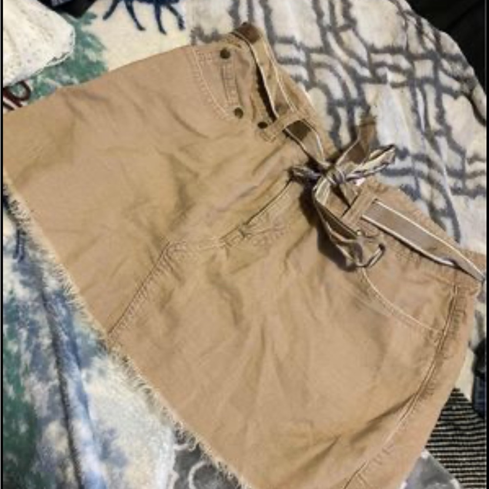 Tan colored tilt skirt. size 7.